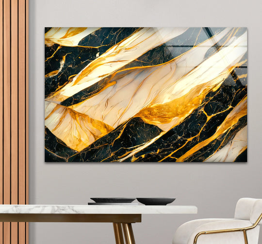A horizontal rectangular glass wall art decor piece featuring abstract golden and black marble textures with flowing shapes.