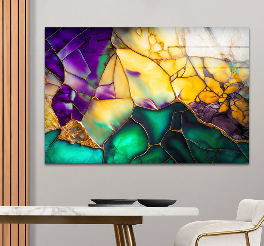 Abstract glass wall artwork showcases a vibrant geode mosaic in emerald, amethyst, and gold hues.