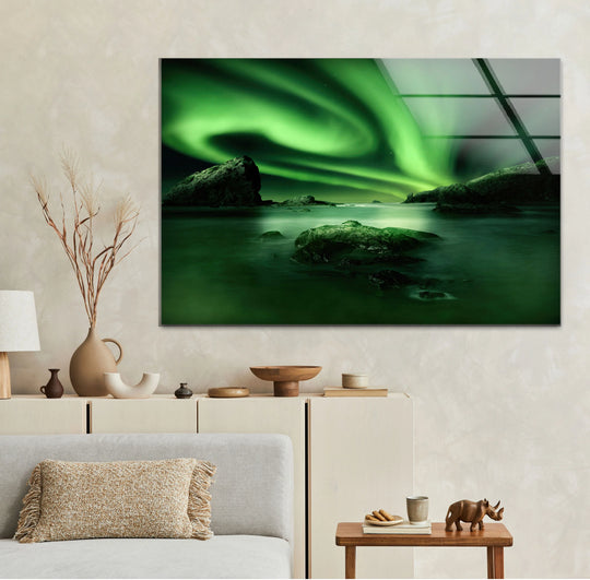 Gradients of bright green showcase the aurora borealis on this Northern Lights glass print, a piece of unique modern wall decor where the sky blends into the ocean.