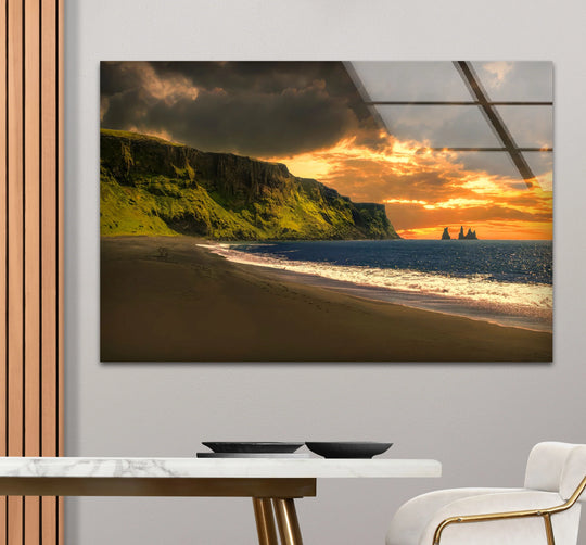 The brightest area illuminates the sunset in this coastal Iceland beach landscape glass printing, a scenic Sunset Cliffs coastal wall art piece.