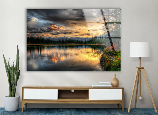 Tempered glass sunset lake wall art captures a forest landscape with a glowing sky and light reflecting on the water, creating a stunning home decoration.