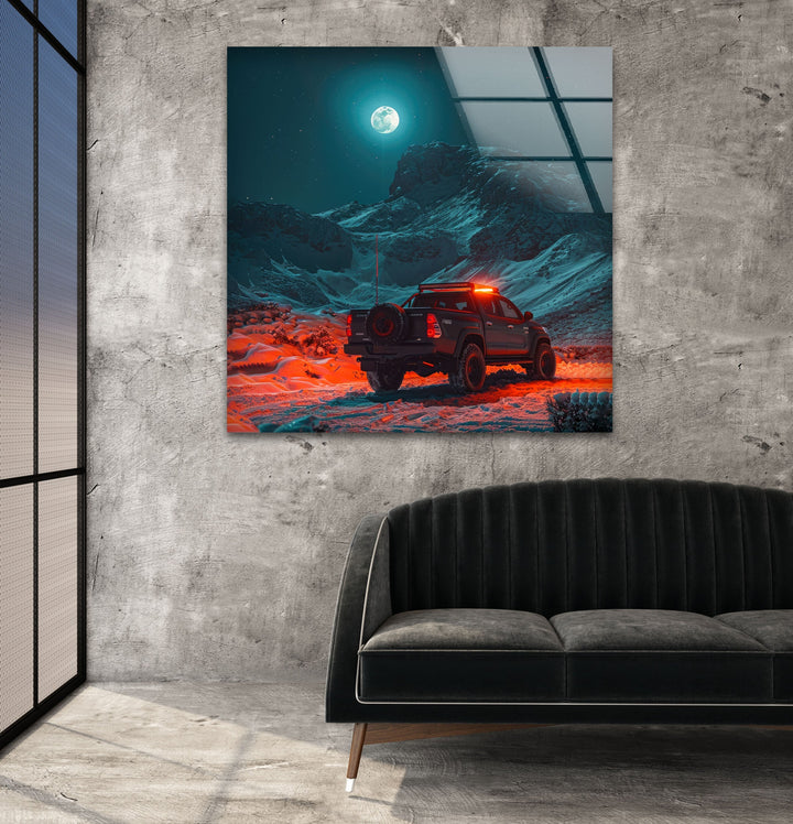A futuristic off-road truck navigating a glowing, moonlit terrain.
