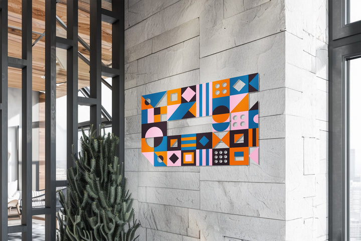 Colorful modern wall sculpture with shapes and bold symmetry