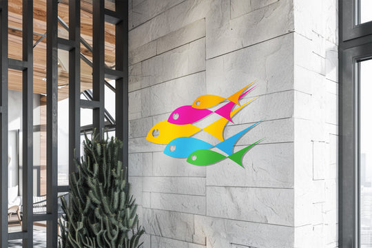 In the stillness, the colorful metal artwork of abstract fish creates a moment of calm amid modern shapes.