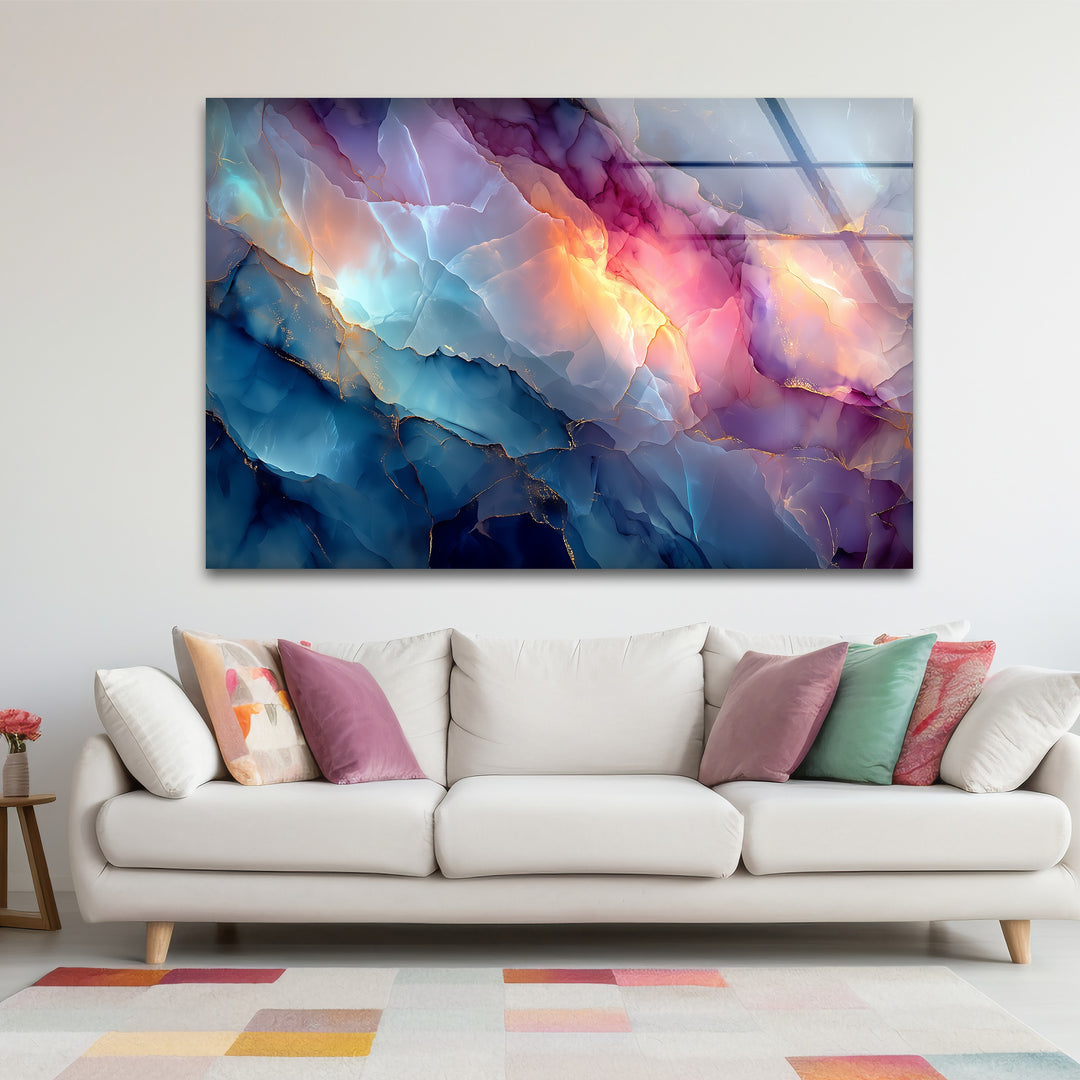 A horizontal rectangular piece of art from glass showcasing a vibrant abstract marble-like fusion of blue, pink, and golden hues.