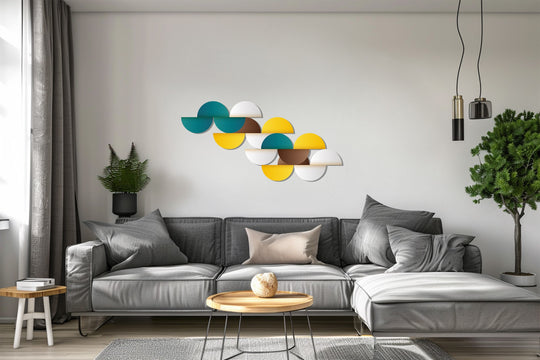 Showcasing the realistic detail of the modern geometric circles metal wall art, a unique metal wall art piece with minimalist teal, yellow, and white semicircles above the gray sofa.