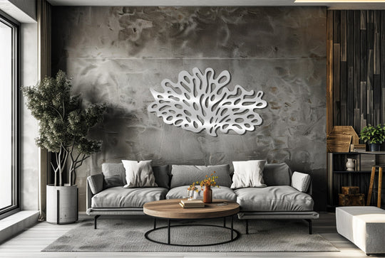 Fluid and organic, the silver coral reef silhouette unique metal wall art seems to ripple across the textured gray wall, suggesting the ocean's gentle sway.