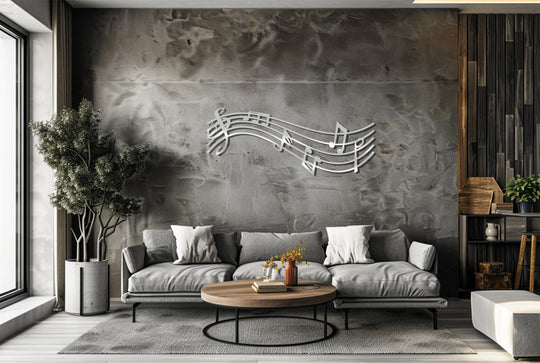 With cool color temperatures, the modern living space features unique metal wall art depicting a flowing musical melody note design above a gray couch.