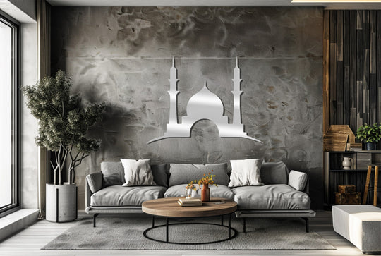 Evoking organic forms, the twin minaret mosque silhouette presents unique metal wall art against a textured backdrop, complemented by a potted plant’s natural curves.