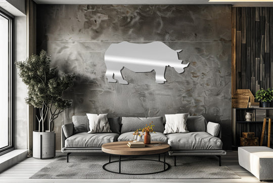 Highlighting the unique metal wall art, the rhino silhouette gleams against the textured wall, reflecting light as a wildlife-inspired art piece.