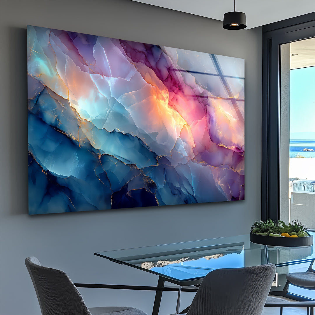 The ethereal transition of vibrant blue, orange, and pink hues across the abstract marble glass wall art decor creates a captivating visual flow.