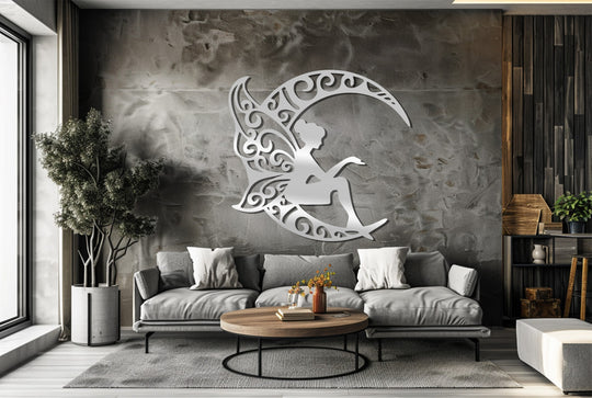 Observing the organic forms of this unique metal wall art, a fairy silhouette nestled within a crescent moon, adding a touch of whimsy to the decor.