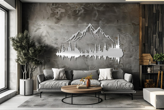 The rustic mountain landscape metal decoration wall art reflecting a forest scene is the focal point above a gray sofa and round coffee table.