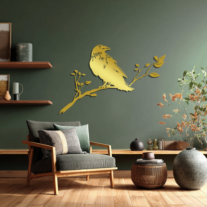 Black raven perched on branch metal wall accent