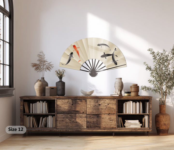 Highlighting the brightest area showcases the decoration wall art of a koi fish fan, an elegant Japanese-inspired piece.