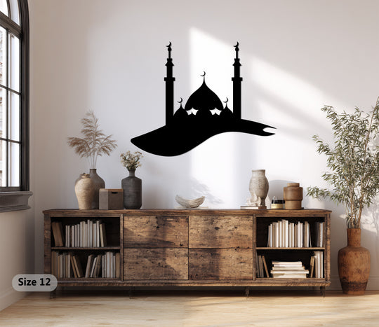 Foreground and background layers create depth in this metal artwork featuring a silhouette of an Islamic mosque with crescent moons.
