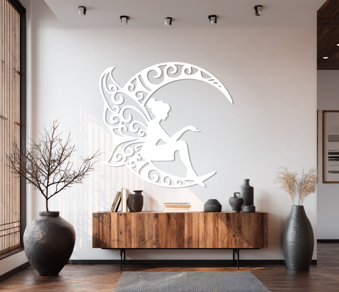 Decorative metal wall art of fairy sitting on crescent moon