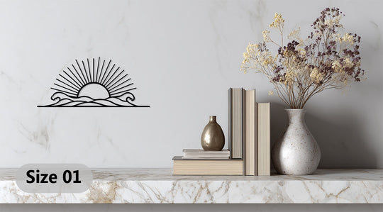 The unique metal wall art of a radiant horizon showcases a sunrise over stylized waves in minimalist black.