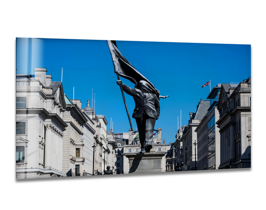 The Freedom March statue creates depth and layers against city buildings and blue sky in Banksy wall prints.
