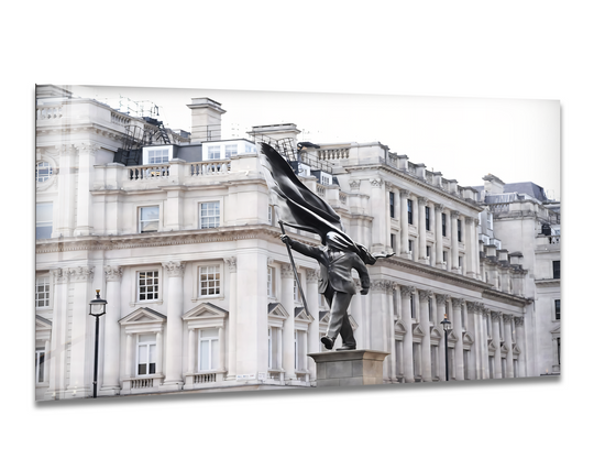 The seamless transition between the dark tones of the Banksy statue and the bright, desaturated London building is captured in this best glass art.