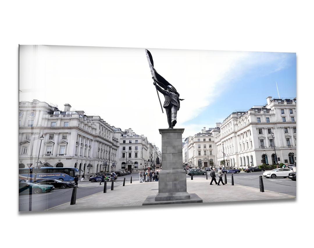 The radiant expanse of the bright sky illuminates the majestic statue in a grand city square, enhancing this stunning home decor.