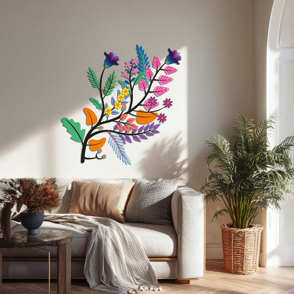 Subtle light and shadow accentuate the depth of this decorative metal art featuring a vibrant botanical branch, a colorful floral sculpture casting gentle forms.
