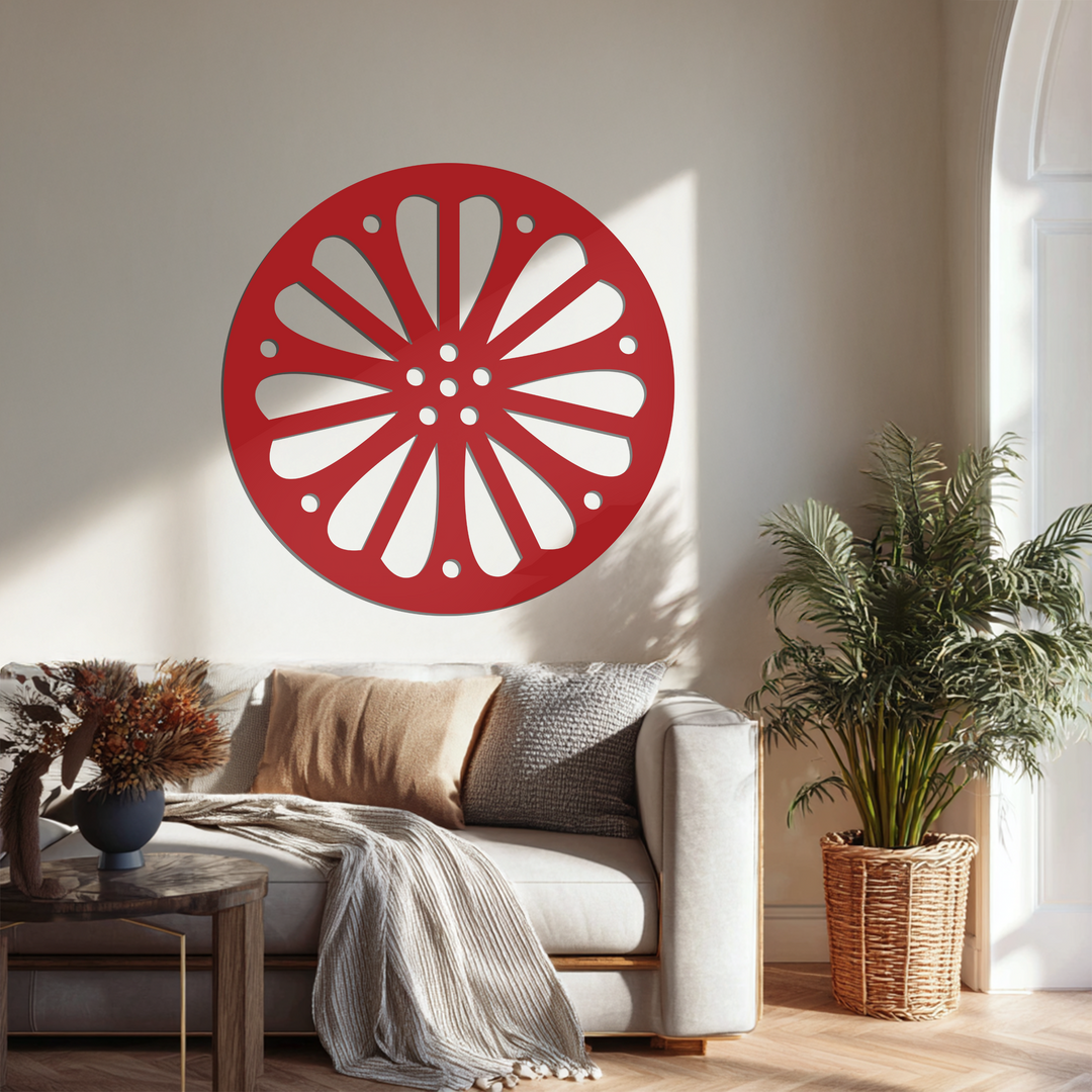 Sunlight softly illuminates the metal art for wall, highlighting the radiating petal pattern of this modern round piece.