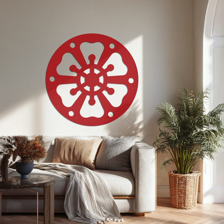 Highlighted edges define the abstract wheel pattern in this piece of metal wall decor, accentuating the round borders of the black metal wall art.