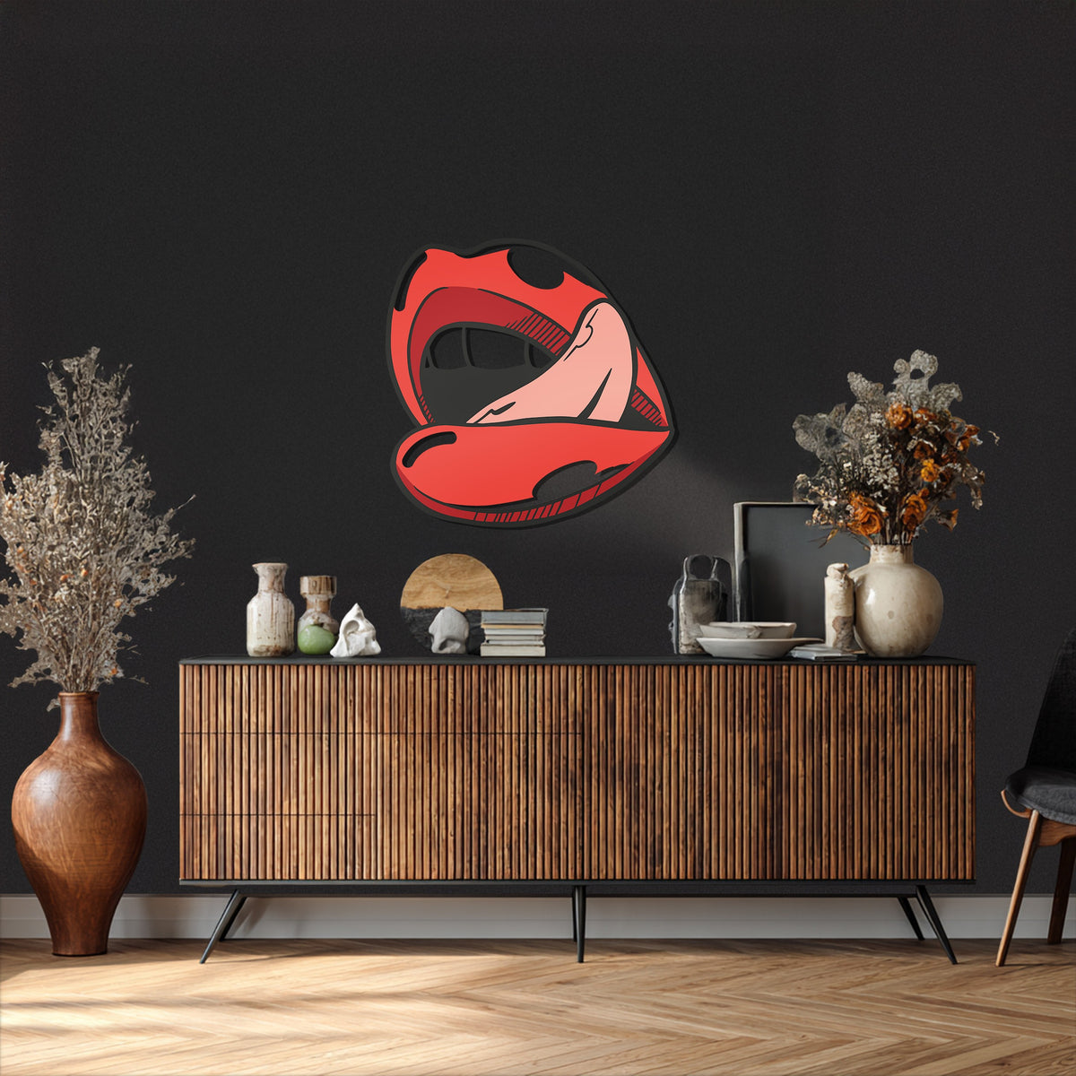 The softest element, the gentle pink tongue, contrasts with the bold red and black of this unique metal wall art, a modern pop art lip design.