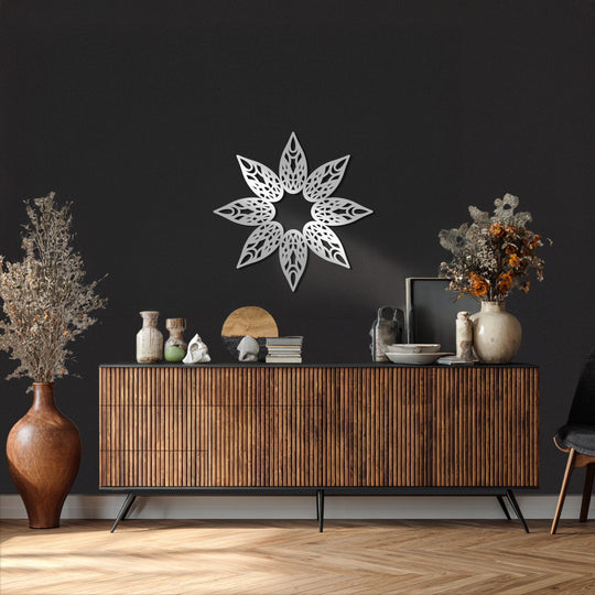 Against the darkest wall, the light-catching starburst Stellar Bloom metal wall decor is an eye-catching piece of modern metal wall art.