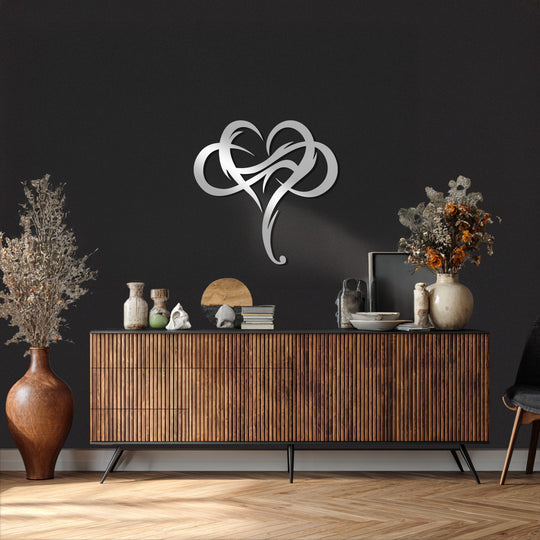 Featuring a sleek silver finish, this tribal heart metal artwork presents an abstract love symbol, bringing modern sophistication to any home decoration.