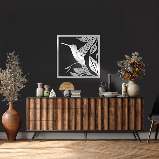 Highlighting the focal point, this unique metal wall art showcases a graceful hummingbird design, bringing nature's inspiration to any room.