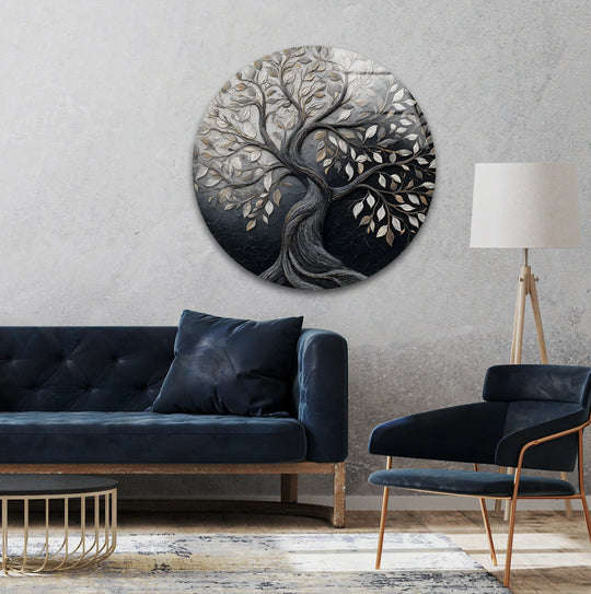 Featuring a circular form, the round glass wall art decor showcases an intricate tree with geometric leaf details in metallic tones against a dark backdrop.