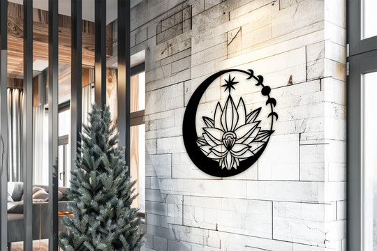 Black decorative metal art shows a lunar blossom, a moon and lotus flower design crafted as wall art against a textured wall.
