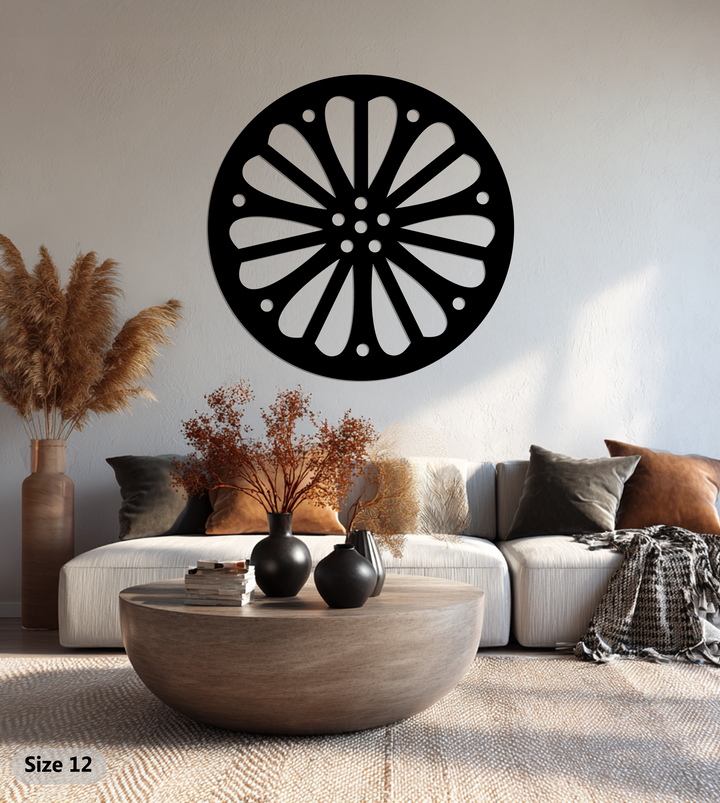 With a warm color temperature, the radiating petal pattern round black metal wall decor casts a soft glow, complementing the neutral tones of the room.