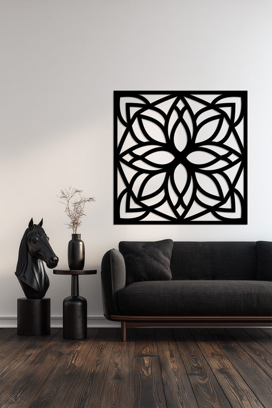 Dominating the space is the black decorative metal art in a geometric floral pattern, lending a bold, modern touch to the room's decor.