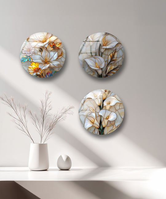 The set is floral glass wall art with blossom and flower designs with gold accents and it is elegant modern home decor on display