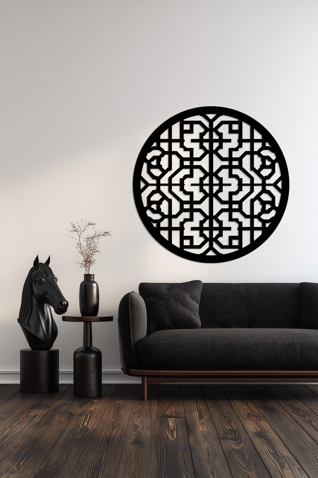 Black round metal wall art with geometric details