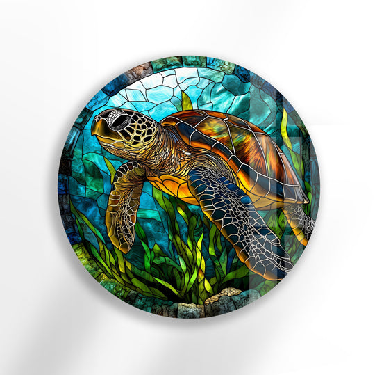 Dominant blues and greens highlight the ocean environment in this sea turtle stained, round tempered glass wall art design, showcasing a vibrant coastal scene.