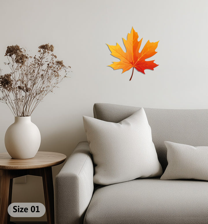Warm color temperature radiates from the golden and red hues of this autumnal maple leaf metal decoration wall art, creating a cozy fall atmosphere.