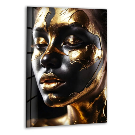 A close-up of a Black and gold African face adorns this striking glass printing, featuring subtle dark borders and edges.