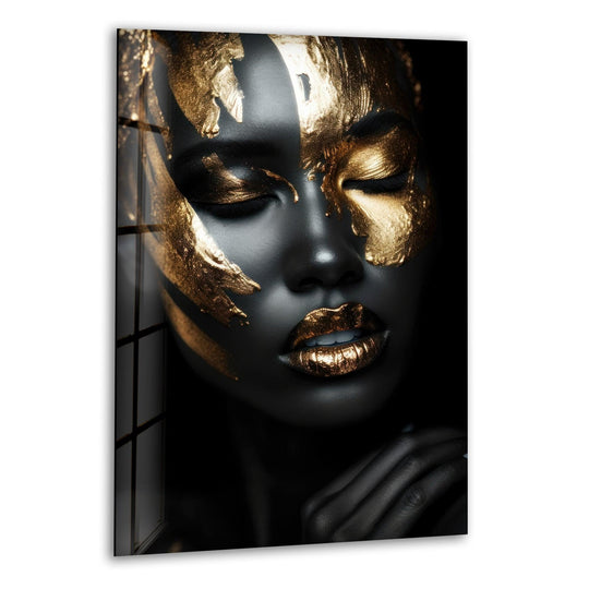 A black woman with soft, closed eyes is adorned with shimmering gold accents, perfect for premium glass printing.