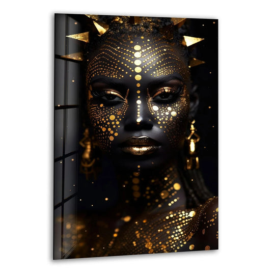 Detailed gold face paint adorns a striking African woman, showcasing the intricate patterns of this best glass art.
