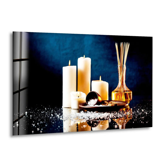 A peaceful spa scene of lit candles and aromatherapy diffuser set on reflective black surface using glass printing.