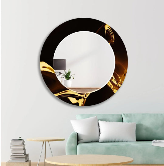 The decorative wall mirror has an abstract black and gold design and is framed wall decor and a luxury wall piece for home decoration