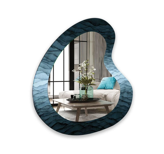 A glass asymmetric mirror with abstract blue waves showing a gradient ocean inspired design and vertical orientation