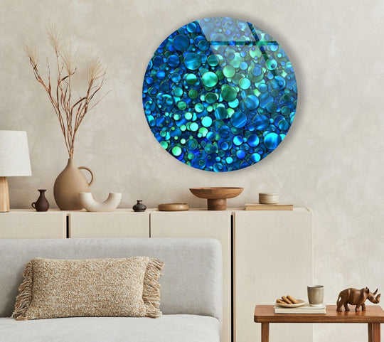 Cool color temperatures emanate from this abstract blue bubbles round tempered glass wall art, creating a visually calming and modern aesthetic.