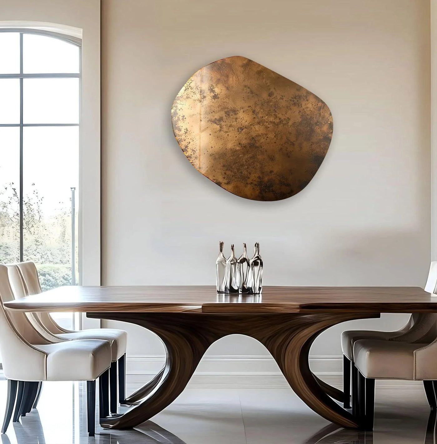 A striking abstract copper color oval art from glass hangs above a modern dining table with elegant glass bottle sculptures.