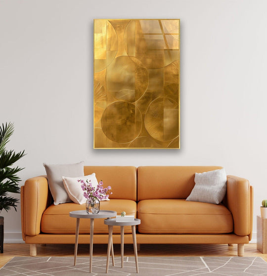 Glass wall art featuring organic circular forms and interwoven lines in a striking gold finish.
