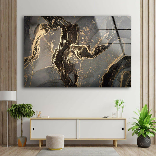 Negative space highlights the stunning abstract gray and gold glass wall art, a piece of best glass art.